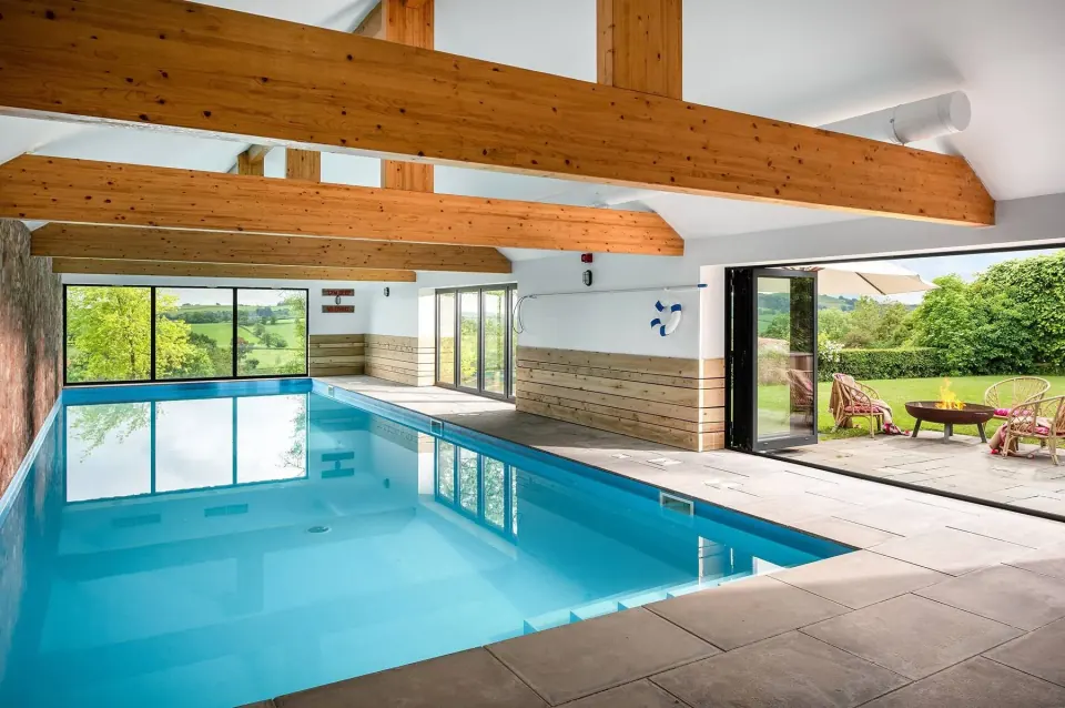 The indoor swimming pool overlooking the Somerset countryside at the house